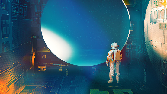 Working in space. Astronaut or scientist wears a space suit and stands in either a space station or a space ship. The person looks out of a window.