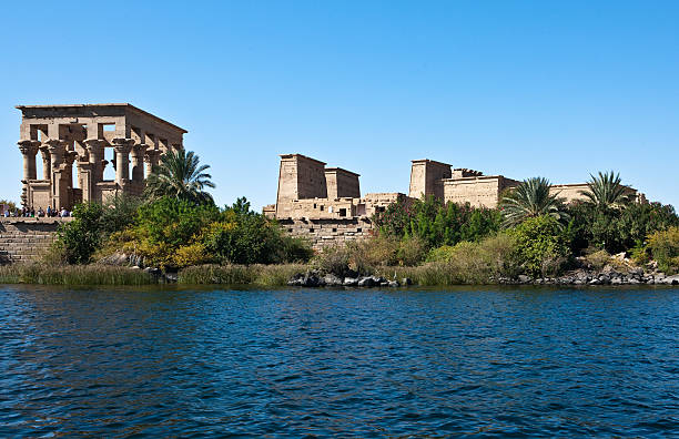 Aswan "Egypt, Aswan, view of the Philae temple on the Nile river" aswan egypt stock pictures, royalty-free photos & images