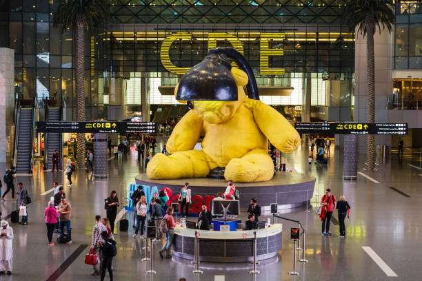 At the Doha Hamad International Airport airport by the well known Lamp-Bear stock photo