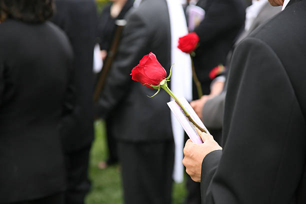 At the Funeral (burial)  funeral stock pictures, royalty-free photos & images