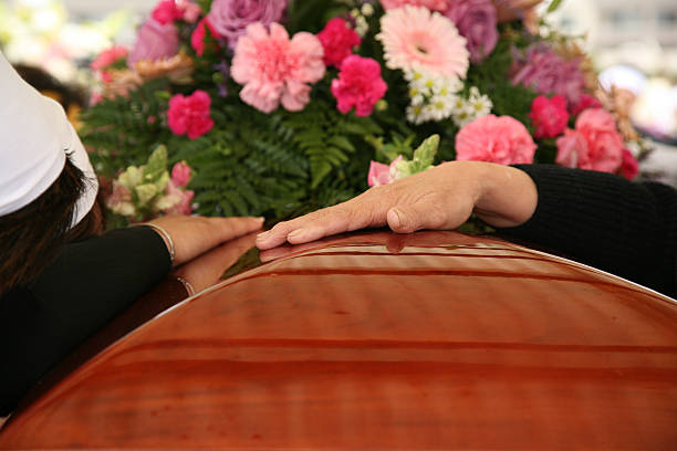 At the Funeral (burial)  funeral stock pictures, royalty-free photos & images