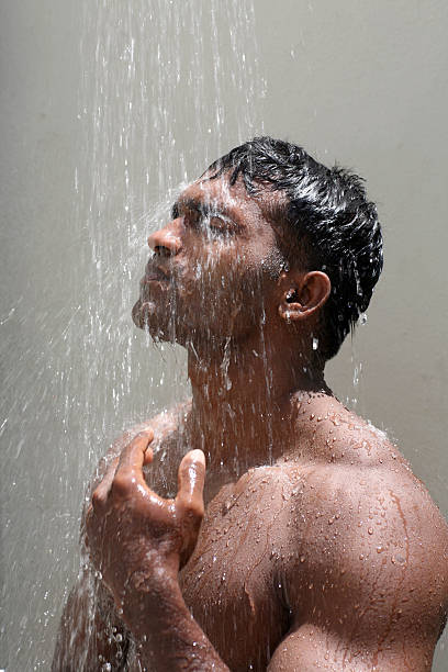 man having bath with cold water