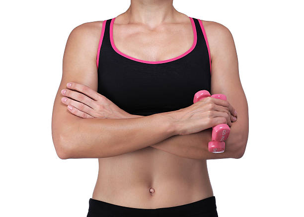 athletic woman crossing her arms stock photo