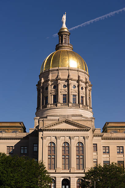 Atlanta Georgia State Capital Gold Dome City Architecture The golden capital dome stands out against a blue sky in Atlanta architectural dome photos stock pictures, royalty-free photos & images