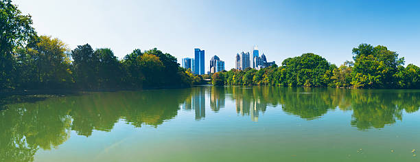 Atlanta Skyline reflected in Piedmont Park lake stock photo