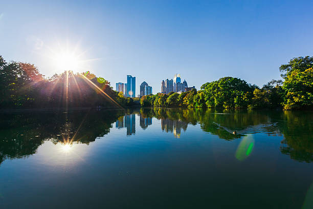 Atlanta Skyline reflected in Piedmont Park lake stock photo