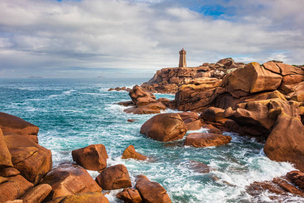 Atlantic ocean coast with lighthouse in Brittany near Ploumanac'h, France stock photo