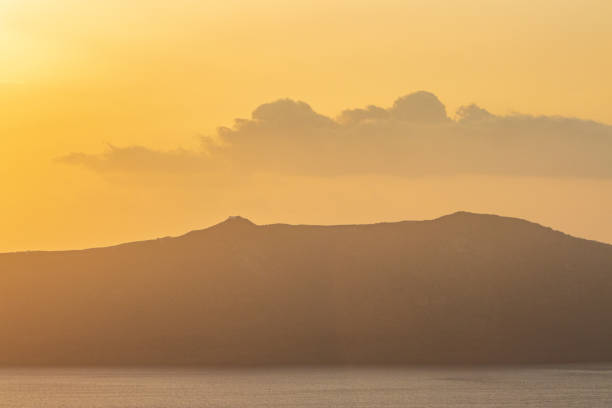 Atmospheric Haze at Sunset over Santorini Caldera in South Aegean Islands, Greece stock photo