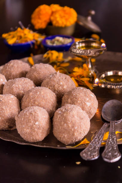Atta Ladoo Wheat Flour Ladoo is a popular Indian sweet dish, made during the Indian festival of Diwali and during the winters. It has flour, sugar and ghee. mithai stock pictures, royalty-free photos & images