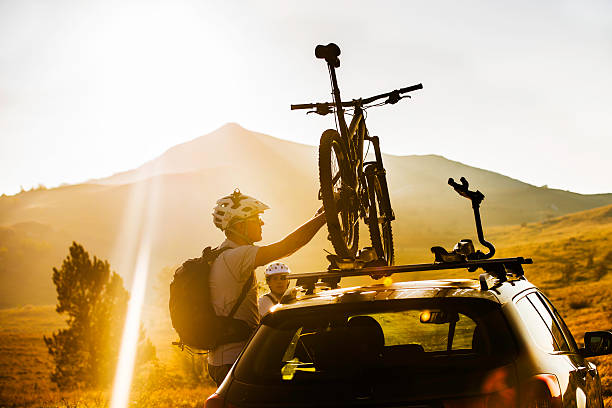 Attaching a Bike to a Roof Carrier on a Car stock photo