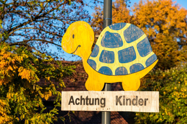 Attention children street sign in the shape of a turtle stock photo