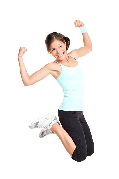 Attractive active woman jumping stock photo