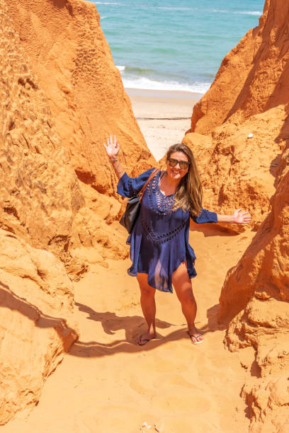 Attractive Brazilian woman on beach ravine stock photo