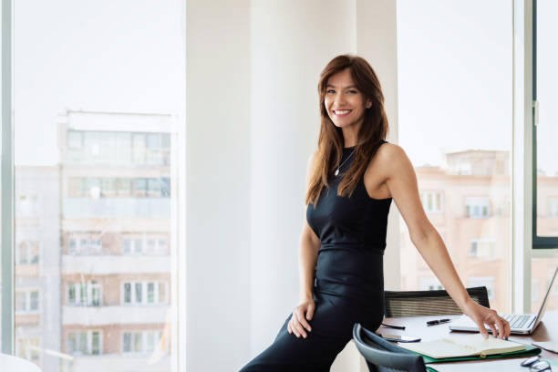 Attractive businesswoman standing at the office stock photo