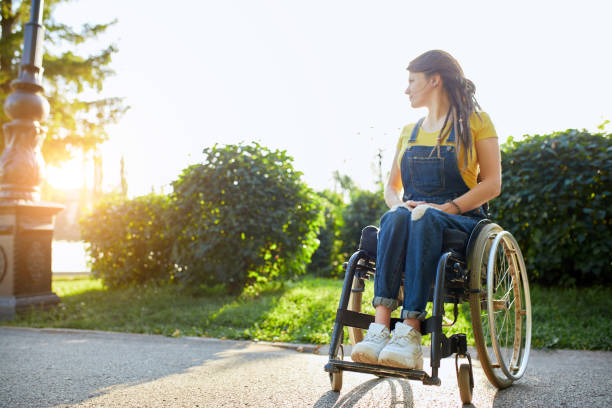 attractive girl waiting for a new day, new life - wheelchair street happy imagens e fotografias de stock