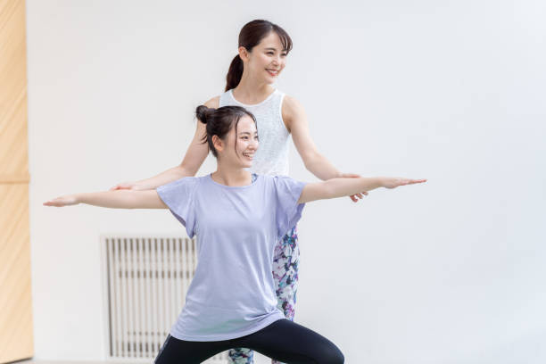 attractive japanese women exercising in the living room  asian yoga pants stock pictures, royalty-free photos & images