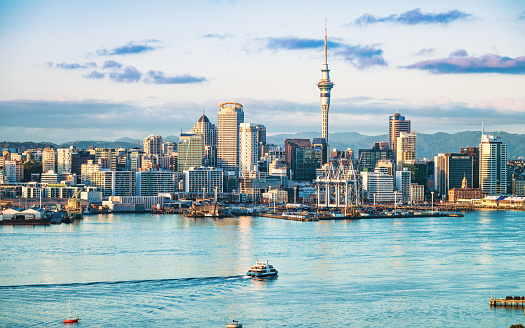 An early morning view of the CBD of Auckland, across the water of Waitemata Harbor.