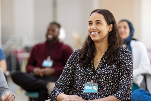 Audience smiling during a seminar stock photo