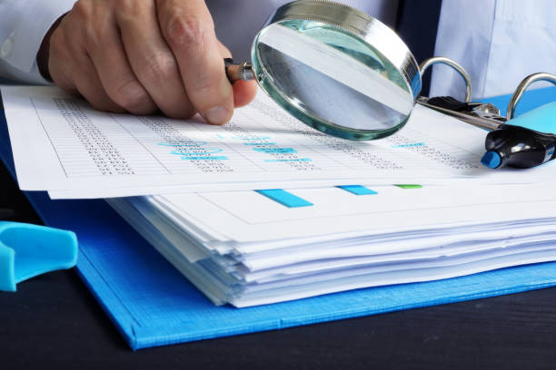 Auditor is working with financial documents. Audit or assessments. Auditor is working with financial documents. Audit or assessments. audit stock pictures, royalty-free photos & images