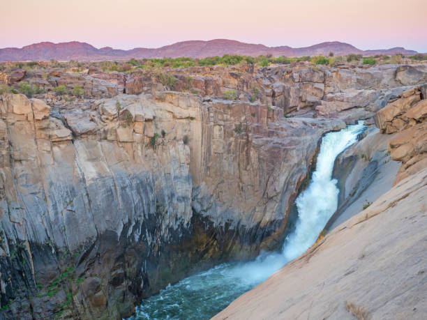 Augrabies Falls Augrabies Falls in the Northern Cape, South Africa, at dusk. augrabies falls national park stock pictures, royalty-free photos & images