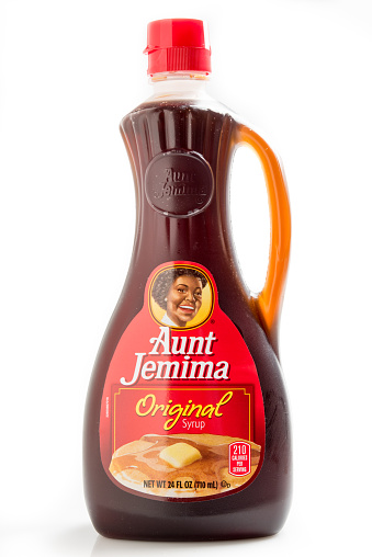 Bottle of Aunt Jemima Brand Original Syrup on White Background.Aunt Jemima...