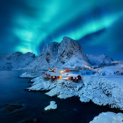 Aurora Borealis, Lofoten islands, Norway. View on the houses in the Hamnoy village, Lofoten Islands, Norway. Iconic view in Norway. High resolution photo.
