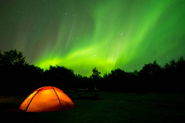 Aurora Borealis on Iceland and a camping tent stock photo