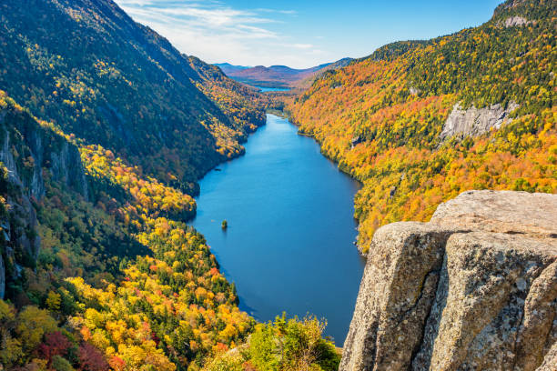 Ausable Lake Adirondack State Park New York State USA in Autumn Lower Ausable Lake in the Adirondack Mountains, New York State, USA, on a sunny day during Fall colors. adirondack state park stock pictures, royalty-free photos & images
