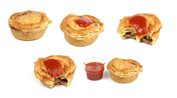 Aussie meat pies Australian meat pie collection with and without tomato sauce. meat pie stock pictures, royalty-free photos & images