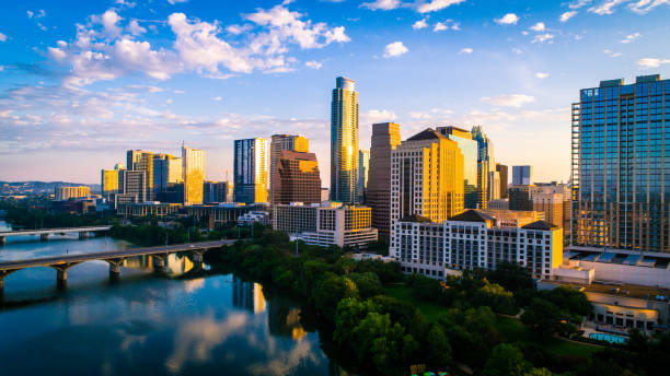 Austin texas home of Live Music Festivals and SXSW Austin Texas aerial drone above Lady Bird Lake on colorful sunrise - Austin texas home of Live Music Festivals and SXSW - capital cities austin texas stock pictures, royalty-free photos & images