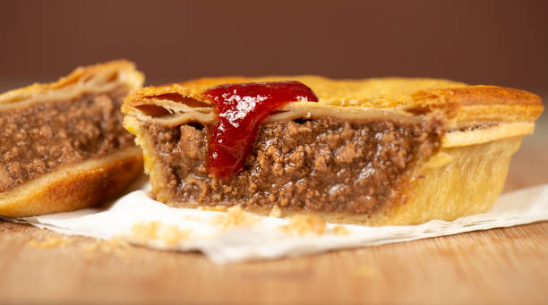Australian Plain Mince Meat Pie Detailed closeup of a fresh baked Australian plain mince pie. meat pie stock pictures, royalty-free photos & images