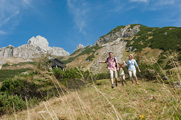Austria,Salzburg Country,Filzmoos,Family hiking on alpine pastur stock photo