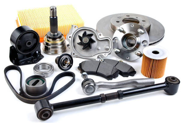 Auto parts background. Hub, pump, brake pads, filter, timing belt, rollers, constant velocity joints, thermostat and other on white background. Set of spare parts for repair stock photo