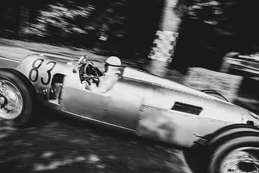 Auto Union Grand Prix Rennwagen Type C V16 driving at high speed. The Auto Union Grand Prix cars were racing for Nazi Germany in the 1930s. The car is doing a demonstration drive during the 2017 Classic Days event at Schloss Dyck.