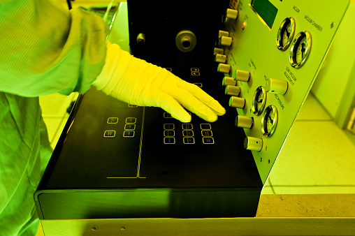 Scientist Developing Mask Patterns Of Sensors On Semiconductor Wafer In A Photolithographic Room