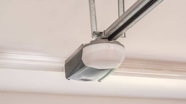 Automatic Garage Door Opener Motor on the Ceiling. Close Up. Automatic Garage Door Opener Motor on the Ceiling. Close Up electric motor stock pictures, royalty-free photos & images