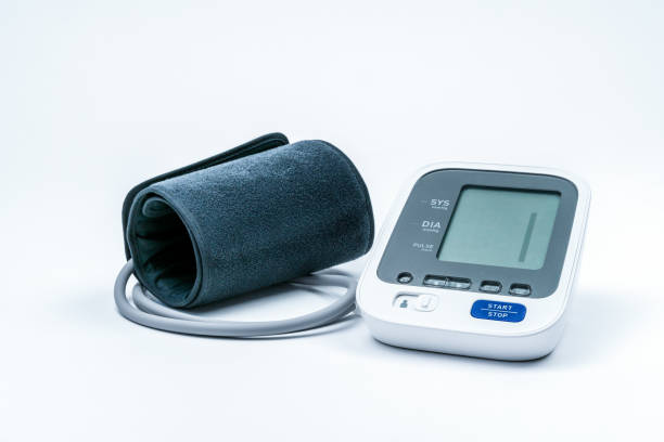 Automatic portable blood pressure machine with arm cuff isolated on white with copy space, studio shot. stock photo