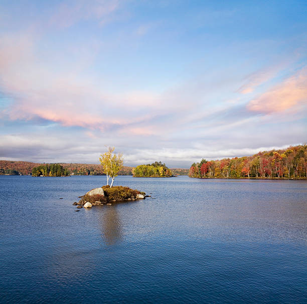 Autumn At Tupper Lake "Morning Light Over Tupper Lake During Autumn In The Adirondack Mountains, New York, USA" tupper lake stock pictures, royalty-free photos & images