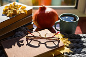 istock Autumn composition on the theme of autumn and home reading. 1346055050