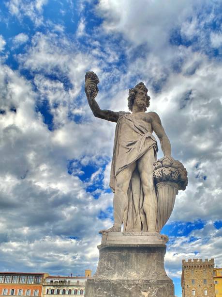 “autumn” - giovanni caccini (1608), is a stone statue of the ponte santa trìnita (holy trinity bridge) spanning the arno river, florence, tuscany, italy. stock photo