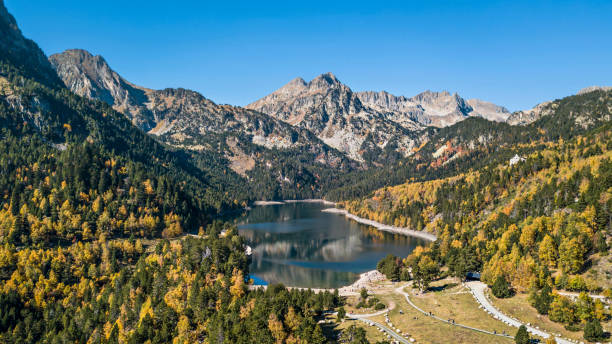 Autumn in Sant Maurici lake, Pyrenees, Catalonia, Spain Autumn in Sant Maurici lake, Pyrenees, Catalonia, Spain catalonia stock pictures, royalty-free photos & images