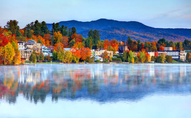Autumn on Lake Placid, New York Lake Placid is a village in the Adirondack Mountains in Essex County, New York, United States. adirondack state park stock pictures, royalty-free photos & images