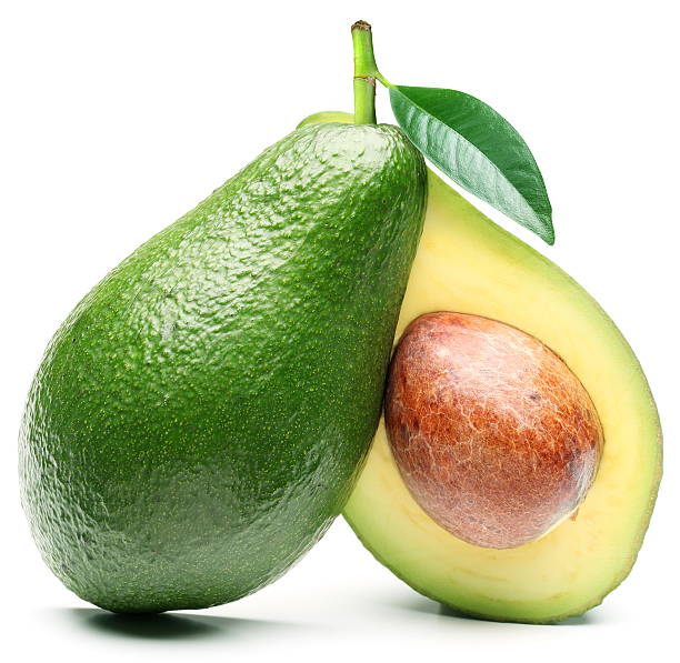 avocado isolated on a white background - avocado stockfoto's en -beelden