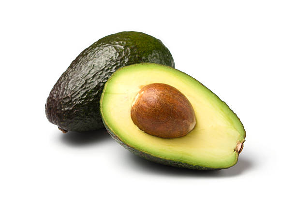 avocados isolated on white - avocado stockfoto's en -beelden