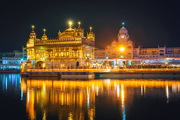 Awsome Sikh Golden Temple at Night Amritsar India The Harmandir Sahib or Darbar Sahib(Temple of God), also the Golden Temple, is an important Sikh gurdwara located in the city of Amritsar, Punjab, India. Amritsar - "Pool of the Nectar of Immortality"). golden temple stock pictures, royalty-free photos & images