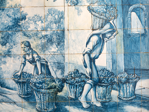 Funchal, Portugal - Sept 12 2016: Azulejo on the wall Mercado dos Lavradores a fruit, vegetable, flower and fish market in Funchal, Madeira. The building was designed by Edmundo Tavares