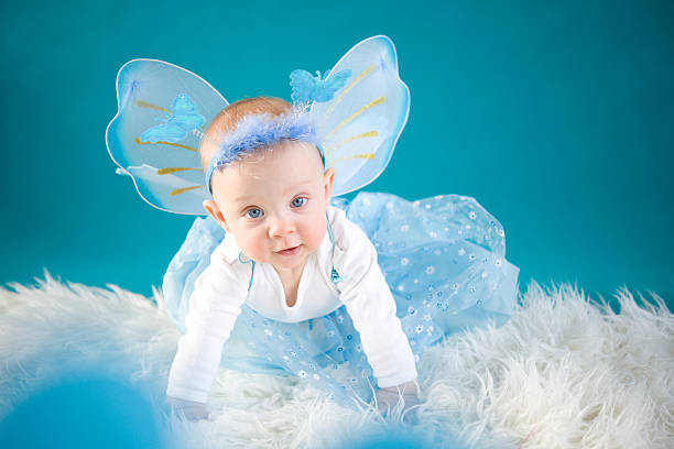 Baby and butterflies wings stock photo