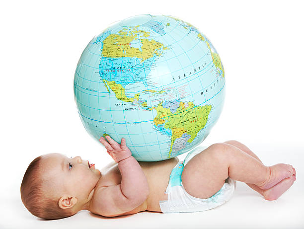 Baby and earth globe stock photo