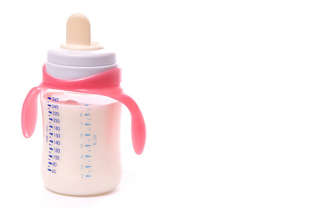 a baby bottle filled with formula - baby formula stok fotoğraflar ve resimler