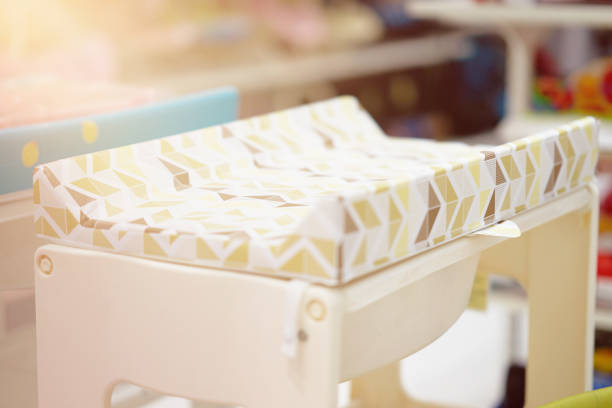 baby changing diapper or pad table with sun stock photo
